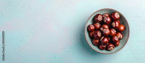 Horse chestnuts in bowl on ...