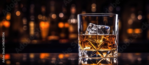 Elegant whiskey glass on a ...