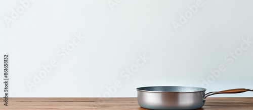 An empty pan is placed on a...