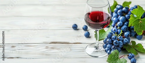 Red wine glass and blue gra...