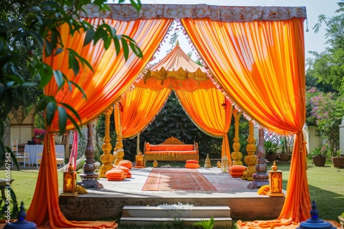 Orange Draped Wedding Mandap Decorated with Flowers photo