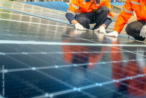 Wallpaper Mural Two engineer hands inspect newly installed solar panels on black with blurry reflections of technicians wearing reflective vests. Including pictures of solar cell panels with blurred circuit lines. Torontodigital.ca