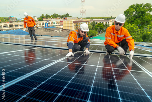 Wallpaper Mural engineer man inspects construction of solar cell panel or photovoltaic cell by electronic device. Industrial Renewable energy of green power. factory worker working on tower roof. Torontodigital.ca