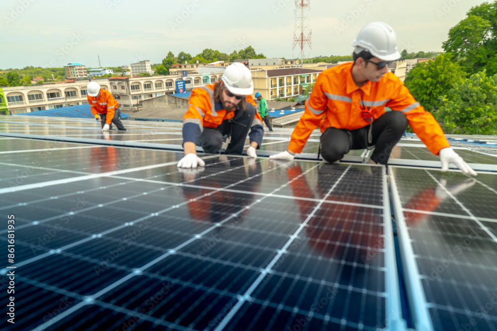 engineer man inspects construction of solar cell panel or photovoltaic cell by electronic device. Industrial Renewable energy of green power. factory worker working on tower roof. engineer man inspects construction of solar cell panel or photovoltaic cell by electronic device. Industrial Renewable energy of green power. factory worker working on tower roof.