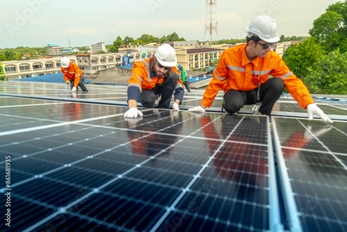 Wallpaper Mural engineer man inspects construction of solar cell panel or photovoltaic cell by electronic device. Industrial Renewable energy of green power. factory worker working on tower roof. Torontodigital.ca