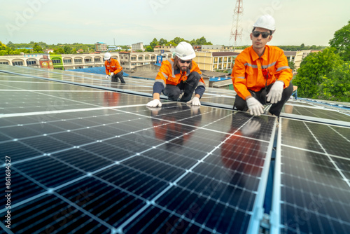 Wallpaper Mural engineer man inspects construction of solar cell panel or photovoltaic cell by electronic device. Industrial Renewable energy of green power. factory worker working on tower roof. Torontodigital.ca