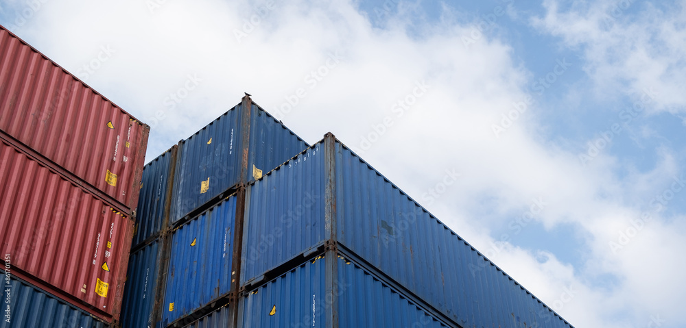 Fototapeta premium Background of container box stack for freight cargo shipping. Logistics import export business at factory warehouse.
