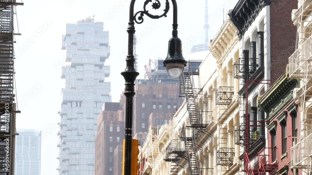 New York City Manhattan Soho fashion district near Broadway street. USA urban building facade, old american architecture. Shopping in NYC, United States. Business and residential real estate. Lantern New York City Manhattan Soho fashion district near Broadway street. USA urban building facade, old american architecture. Shopping in NYC, United States. Business and residential real estate. Lantern
