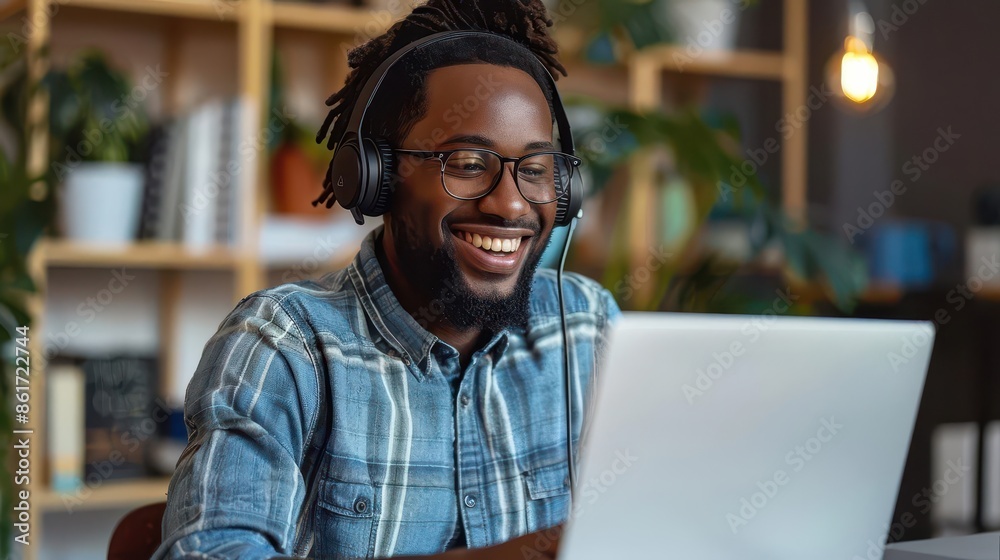 young intern businessman in headphones smiling while using laptop in creative office digital painting young intern businessman in headphones smiling while using laptop in creative office digital painting