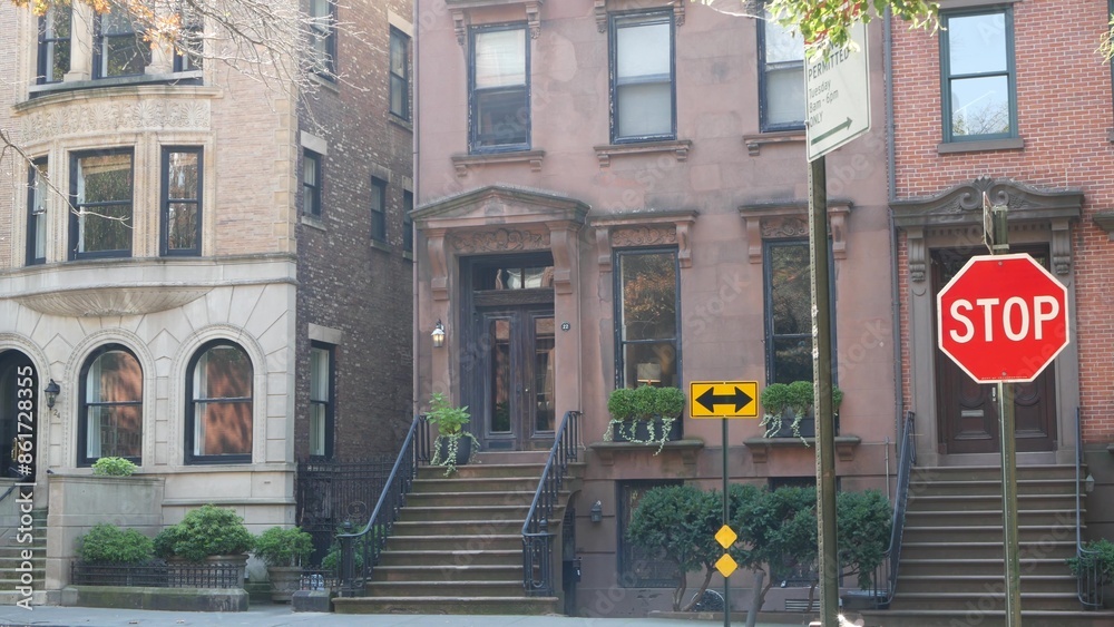 New York City townhouse building, Brooklyn Heights residential district, USA. Brownstone urban architecture, attached house. United States real estate, american property, apartments and homes in NYC. New York City townhouse building, Brooklyn Heights residential district, USA. Brownstone urban architecture, attached house. United States real estate, american property, apartments and homes in NYC.