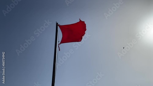 Wallpaper Mural Beach red flag weather wind on blue sky background, The sea has a strong current and big waves. Swimming is prohibited. Torontodigital.ca