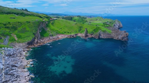 Coastal landscape of meadows and cliffs on the coast of Ensenada Calderon. Aerial view from a drone. Alfoz de Loredo Municipality. Cantabrian Sea. Cantabria. Spain. Europe photo