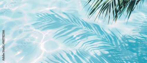Elegant minimalist background concept featuring close-up water surface with gentle ripples and subtle blurred palm leaf shadows on the beach, evoking a peaceful, natural and pure atmosphere.
