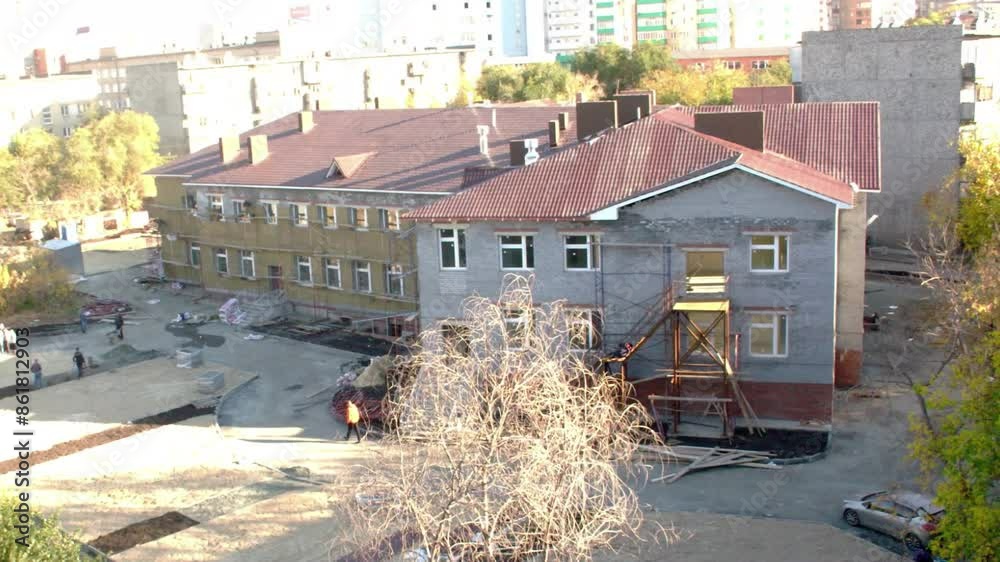 Builders build a brick house from digging a hole to finishing construction.  Time lapse.