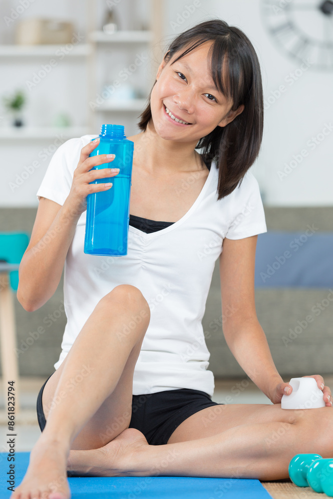 young woman drinking water after fitness sport young woman drinking water after fitness sport