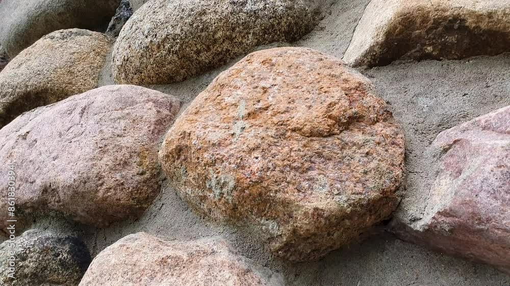 Stone wall of cobblestones. Natural stone wall. Stone wall of cobblestones. Natural stone wall.