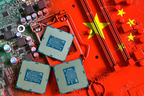 Flag of the Republic of China on a red painted pc motherboard with a CPU. Concept for supremacy in global microchip and semiconductor manufacturing. Italy photo