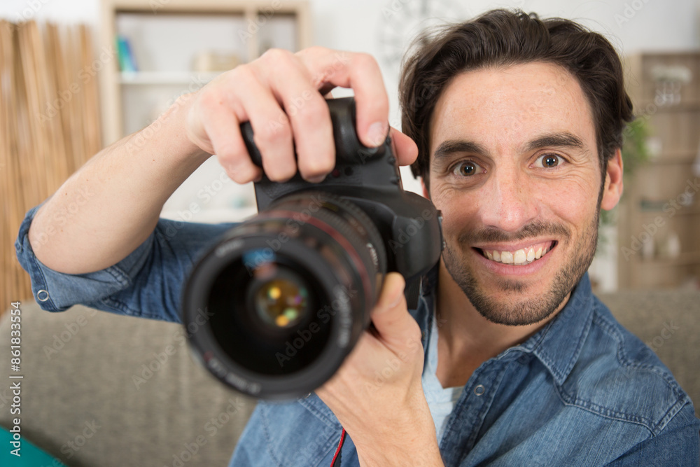 happy photographer working in his studio happy photographer working in his studio