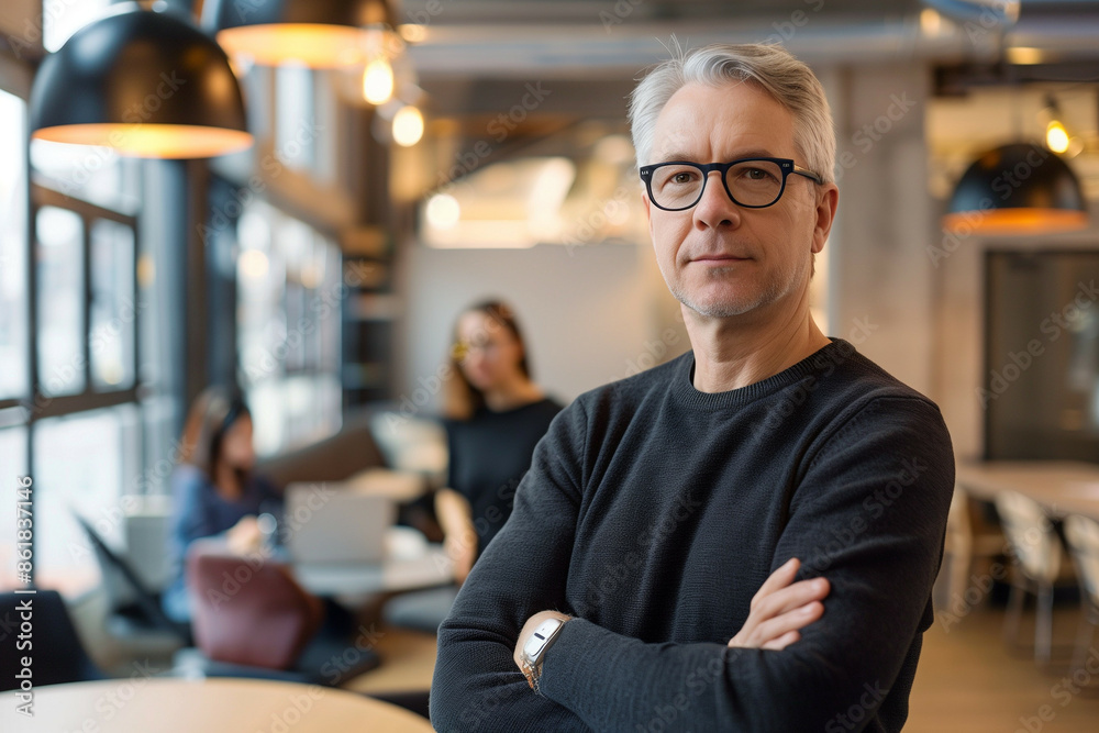 Confident Senior Businessman with Glasses Standing in a Modern Office Space, Portrait of Leadership and Professionalism Confident Senior Businessman with Glasses Standing in a Modern Office Space, Portrait of Leadership and Professionalism