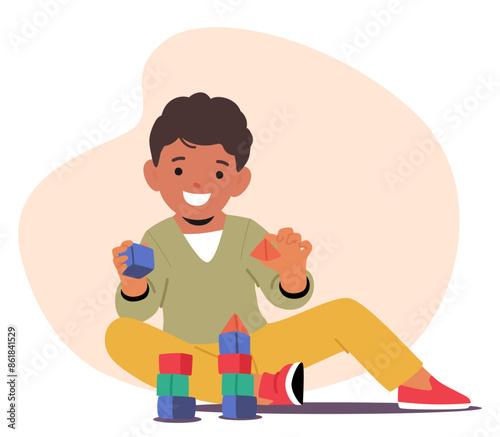 Cheerful Boy Sitting On The Floor And Playing With Colorful Building Blocks, Focusing On Creation And Play