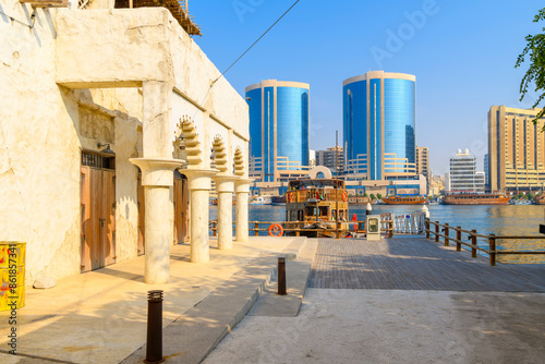 Photography View of dhows and downtown skyline at the Al Seef Dubai Creek shopping, dining and culture center along Dubai Creek, in Dubai, United Arab Emirates