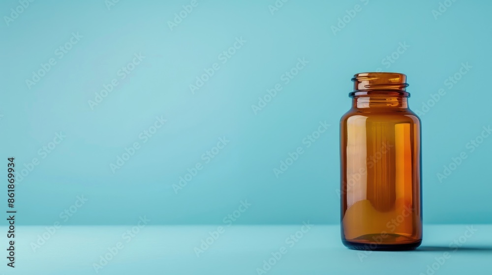 Medical bottle with drug in glass container on blue isolated background Medical bottle with drug in glass container on blue isolated background