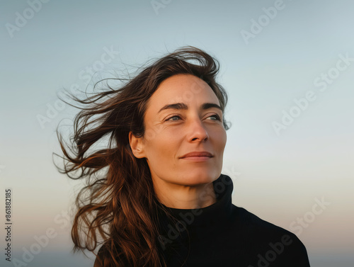Woman with Windswept Hair Looking into Distance