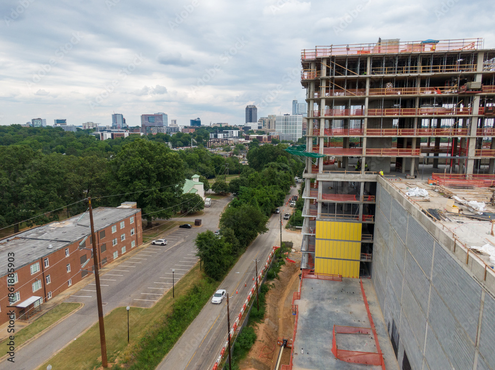 Fototapeta premium Daytime Drone Images of Highrise Construction and the Skyline in Downtown Raleigh North Carolina. Industry, Architecture, Engineering