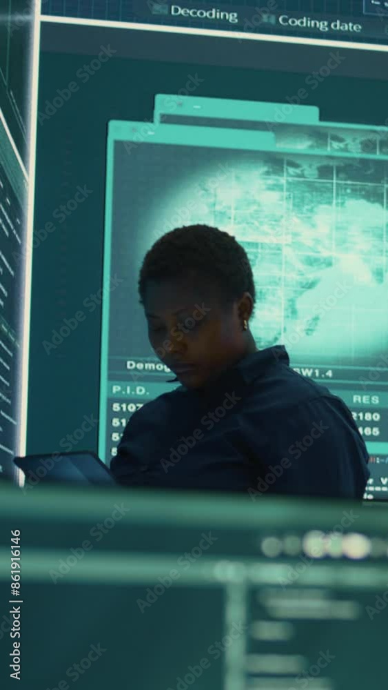 Vertical Video Governmental hacker investigating cyber incidents and monitoring security threats on a big screen. Woman specialist uses phishing techniques to steal important information for Vertical Video Governmental hacker investigating cyber incidents and monitoring security threats on a big screen. Woman specialist uses phishing techniques to steal important information for