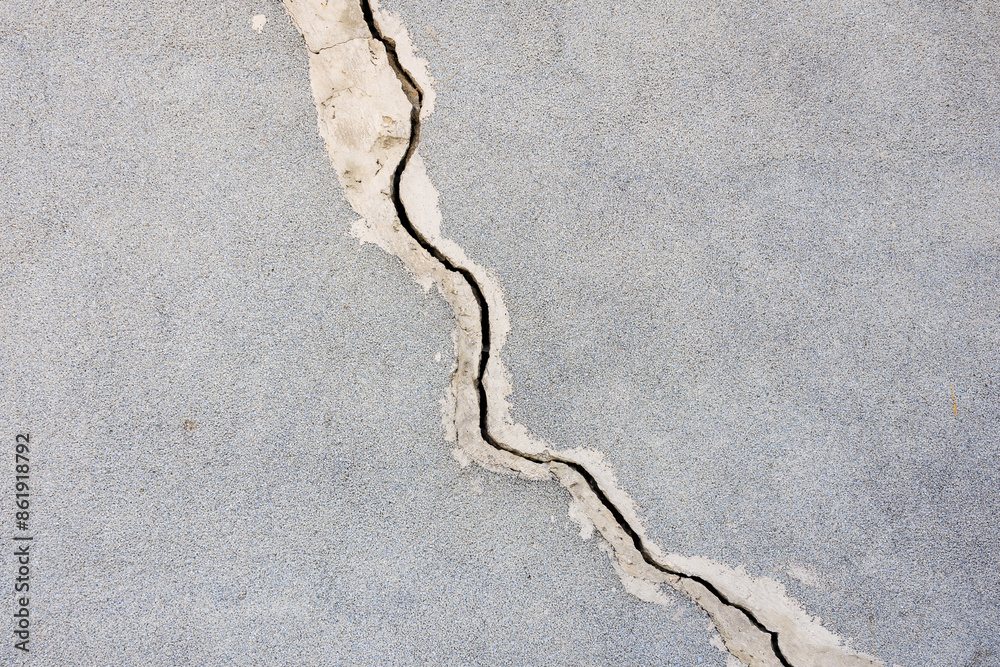 A crack in the concrete is visible A crack in the concrete is visible