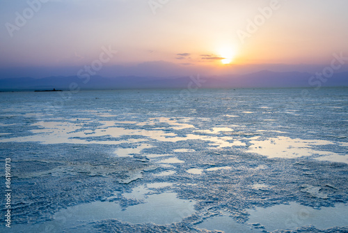 Sunset over Ethiopian Karum salt lake surface, Danakil Depression desert, Afar region, Ethiopia