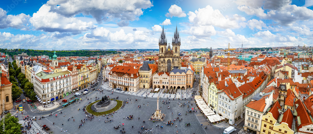 Panoramic view over the old town of Prague, Czech Republic, with Tyn Church and crowded old town square during a sunny summer day
