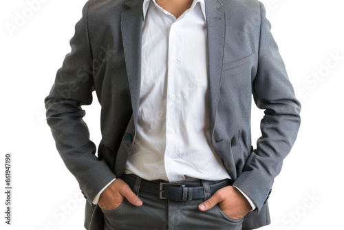 Businessman in suit with hands in pockets. Close-up of a confident businessman standing with his hands in his pockets.