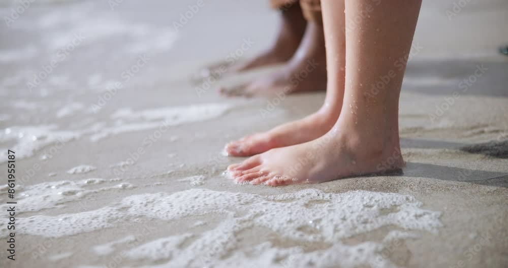 Closeup, beach and people with water, feet and summer with vacation, adventure and carefree. Legs, wet and outdoor with ocean, foam and journey with nature, travel and splash with sand in Australia Closeup, beach and people with water, feet and summer with vacation, adventure and carefree. Legs, wet and outdoor with ocean, foam and journey with nature, travel and splash with sand in Australia