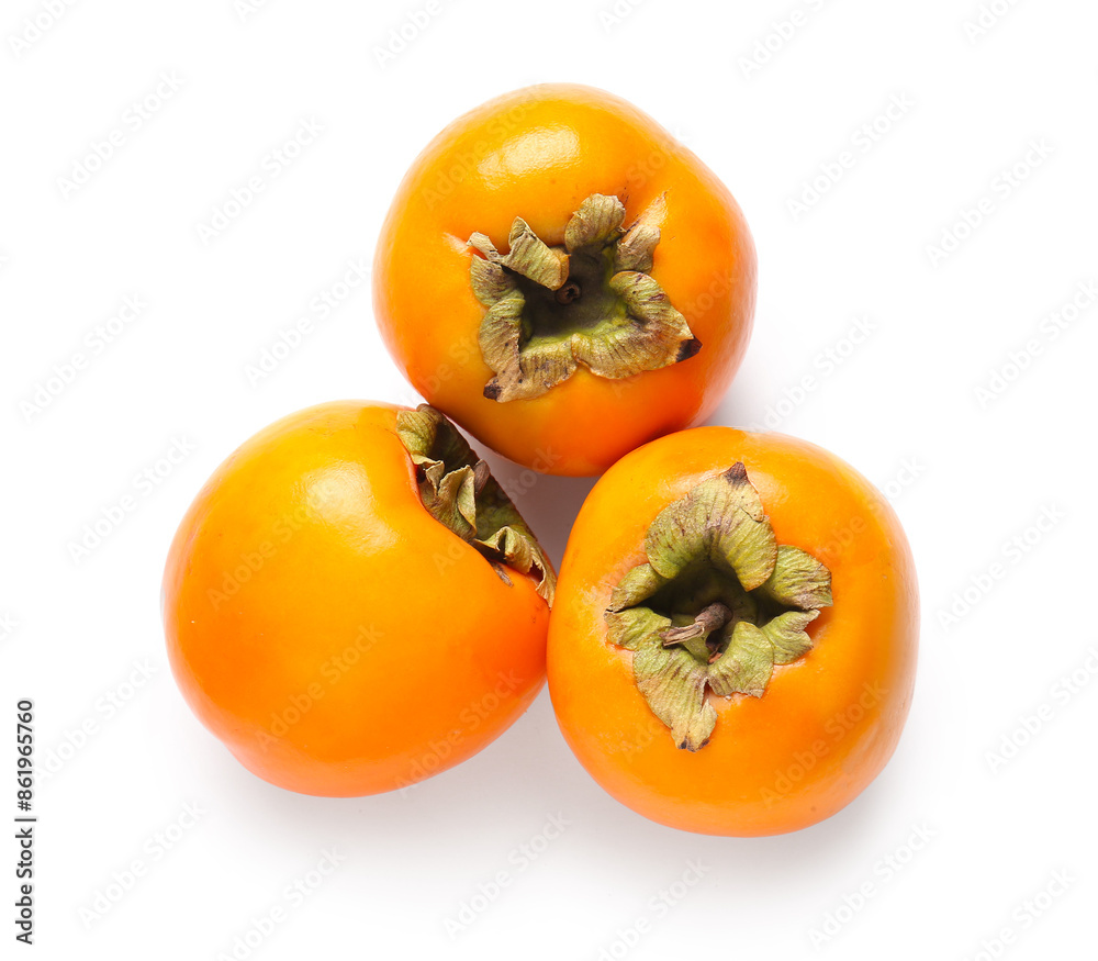 Fresh ripe persimmons on white background