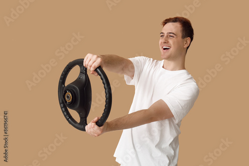 Young man with steering whe...