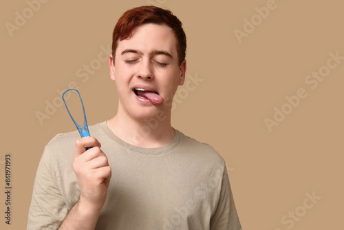 Young man with tongue scrap...