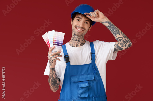 Happy male painter in unifo...