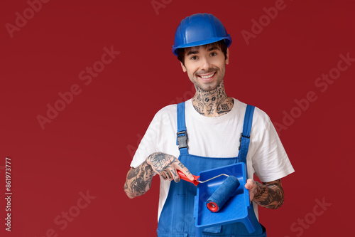 Male painter with roller an...