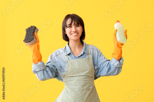Young woman with sponge and...