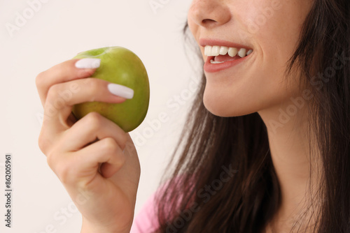 Smiling young woman with ap...