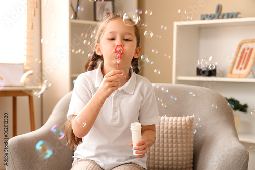 Cute little girl blowing so...