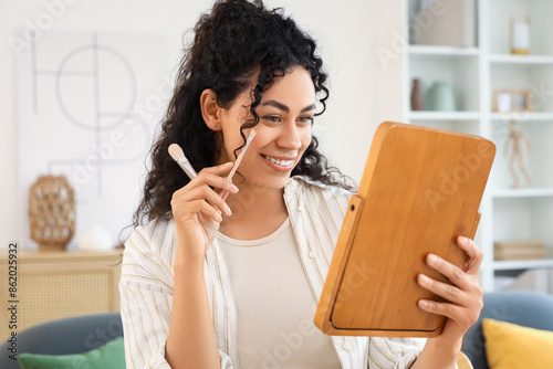 Smiling young woman with cu...