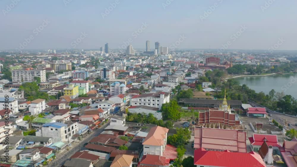 Aerial view of local residential neighborhood roofs. Urban housing development from above. Top view. Real estate in Isan urban city town, Thailand. Property real estate.