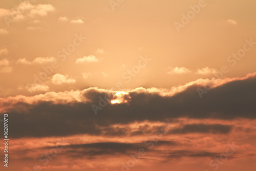 Close up view of sun hidden behind clouds photography