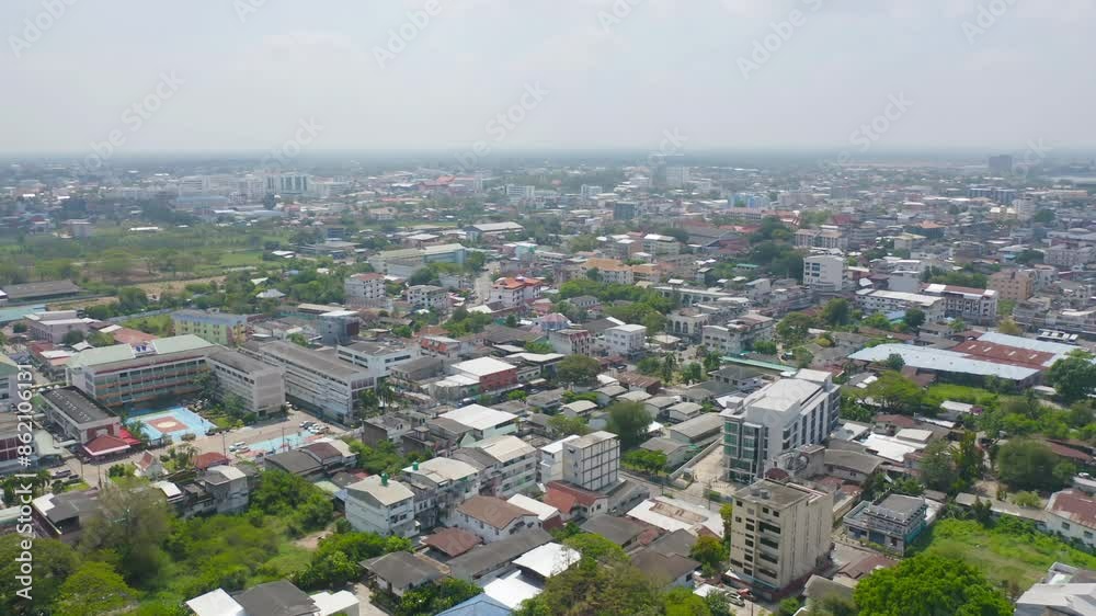 Aerial view of local residential neighborhood roofs. Urban housing development from above. Top view. Real estate in Isan urban city town, Thailand. Property real estate. Aerial view of local residential neighborhood roofs. Urban housing development from above. Top view. Real estate in Isan urban city town, Thailand. Property real estate.
