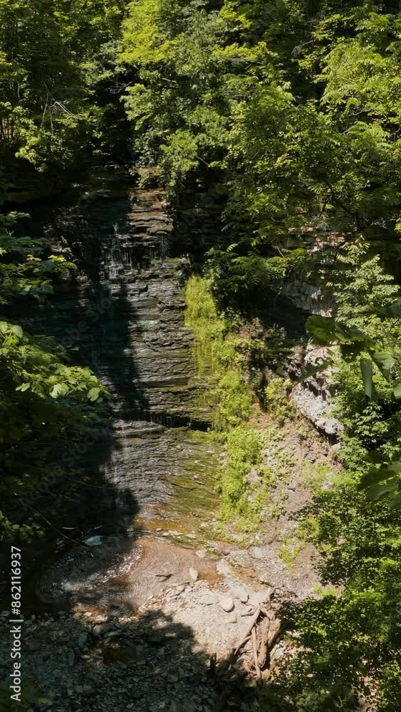 Vertical shot of Swayze Falls along Twelve Mile Creek in Pelham, in the Niagara region of southern Ontario, Canada during a rather low flowing summer day in June, 2024. Vertical shot of Swayze Falls along Twelve Mile Creek in Pelham, in the Niagara region of southern Ontario, Canada during a rather low flowing summer day in June, 2024.