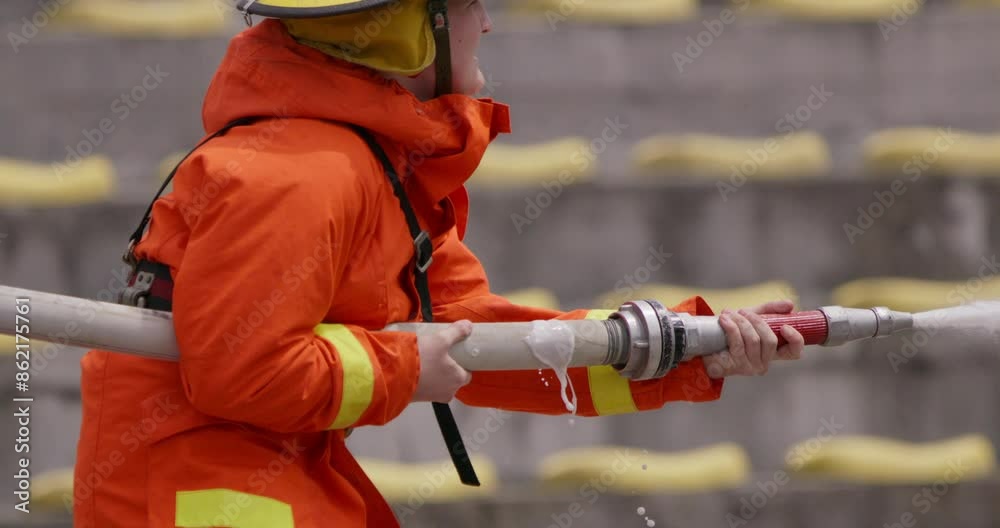 A special team of firefighters seizes hoses from a firetruck and embarks on a perilous mission to extinguish a blazing fire, showcasing their bravery and professional expertise in tackling a hazardous A special team of firefighters seizes hoses from a firetruck and embarks on a perilous mission to extinguish a blazing fire, showcasing their bravery and professional expertise in tackling a hazardous