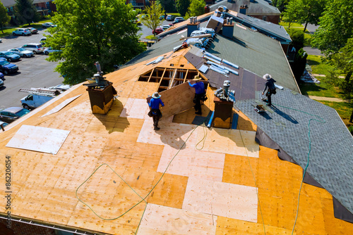 Bild auf Leinwand Replace old asphalt bitumen shingles on house roof in order to repair roof