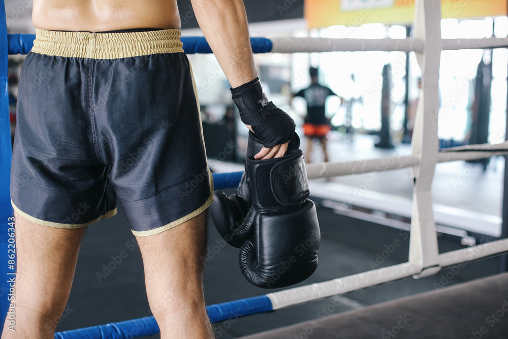 Fighter Man Holding Boxing Gloves In Arena Training Fighter Man Holding Boxing Gloves In Arena Training